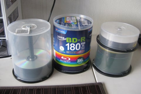 A close-up of several cds

AI-generated content may be incorrect.