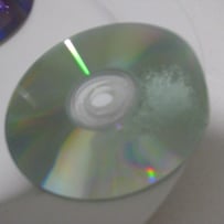 A close-up of a cd

AI-generated content may be incorrect.