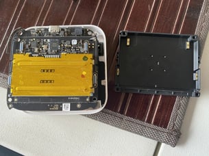 A white box with a yellow rectangular object on a brown surface

AI-generated content may be incorrect.