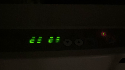 A black rectangular object with green lights

AI-generated content may be incorrect.