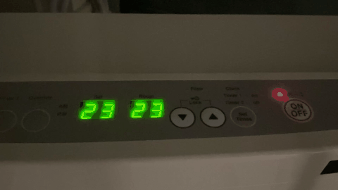 A digital clock with green numbers

AI-generated content may be incorrect.